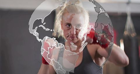 Female boxer training with globe overlay representing global fitness and empowerment