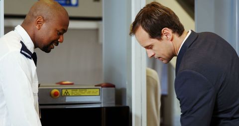 Airport Security Screening Process with Business Traveler and Guard - Download Free Stock Images Pikwizard.com