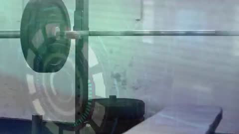 Loaded Barbell Moving into Frame with Teal Futuristic HUD Overlay Displaying Gear Diagnostics