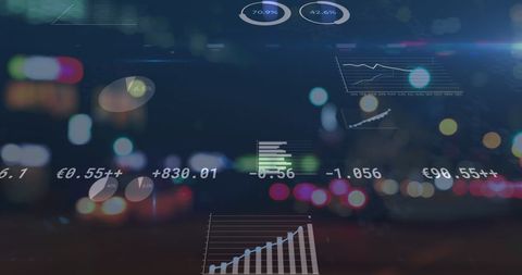 Financial data graphics over blurred cityscape at night