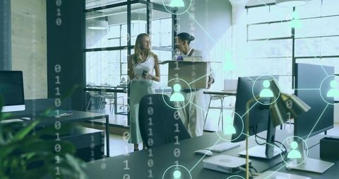 Coworkers Walking and Talking in Modern Open Office with Digital Network Overlay