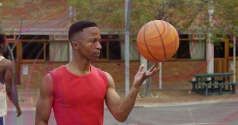 Talented Player Spinning Basketball on Public Court