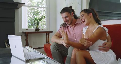 Happy Couple Video Calling from Cozy Living Space