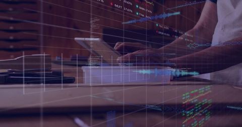 Man Tapping Tablet with Digital Charts Overlay for Business Analytics and Inventory Management