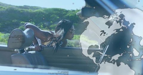 Stylish woman enjoying road trip in convertible car