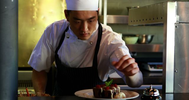 Professional Chef Garnishing Elegant Dessert Plate in Restaurant Kitchen - Download Free Stock Images Pikwizard.com