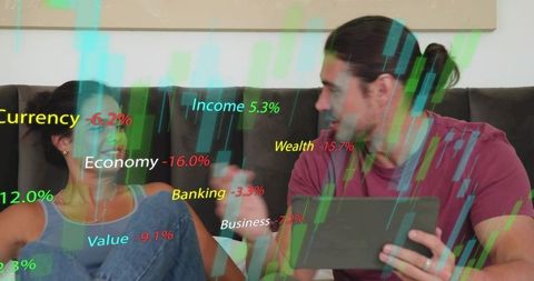 Young couple using tablet on sofa viewing finance analytics and market data overlays