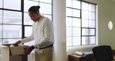 Businessman organizing documents in modern office setup