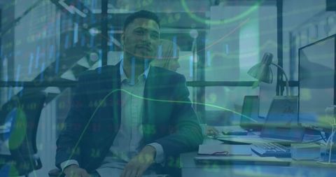 Multinational team analyzing market data in modern office