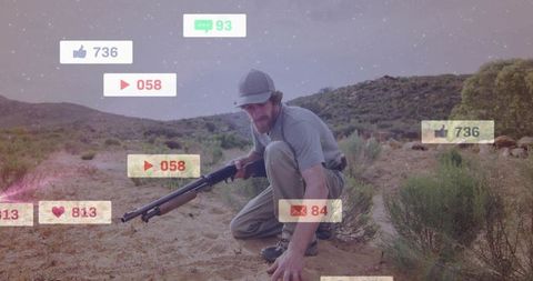 Vigilant hunter crouching with shotgun in desert with floating social media notification icons