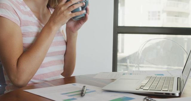 Woman Working on Financial Documents While Drinking Coffee at Home - Download Free Stock Images Pikwizard.com