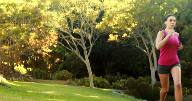 Young Woman Jogging in Park - Download Free Stock Images Pikwizard.com