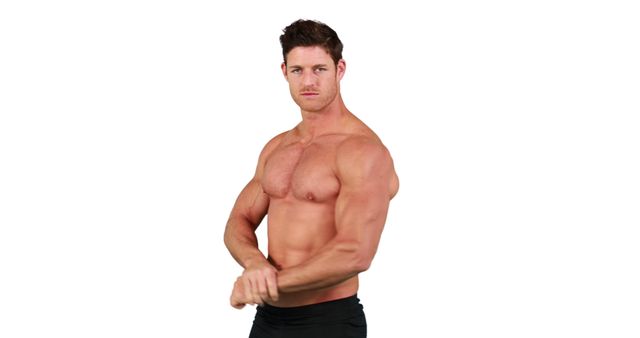 A muscular Caucasian man is posing to showcase his physique, with copy space. His confident stance and well-defined muscles emphasize a strong dedication to fitness and health.