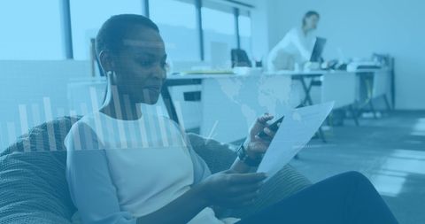 African American Woman Analyzing Data in Office Setting