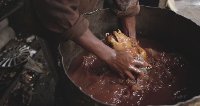 Hands Processing Chicken in Dark Setting - Download Free Stock Images Pikwizard.com