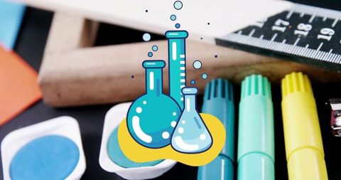 Colourful Science Education Concept with Laboratory Beakers and School Supplies