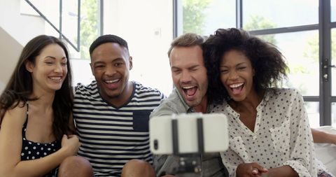 Diverse Friends Laughing Sharing Happy Selfie Indoors