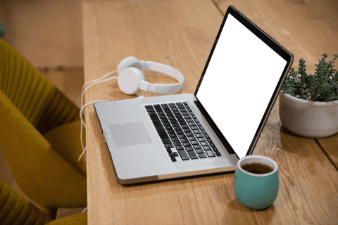 Transparent Laptop Screen with Headphones and Cup on Office Table - Download Free Stock Videos Pikwizard.com