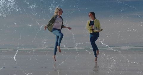 Two friends leaping on beach symbolizing joy and friendship