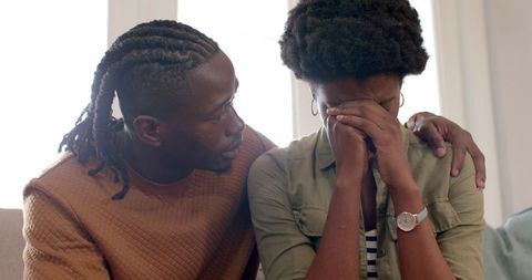 Man Comforting Women in Distress Offering Emotional Support