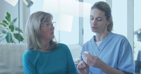 Doctor discussing with senior female patient in a medical facility