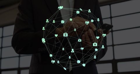 Businessman using smartphone with network connection graphics