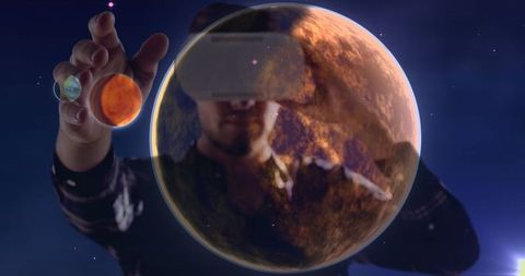 Exploring Virtual Reality: Person Interacting with Digital Planets