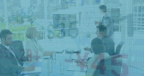 Business team viewing data trends in modern office
