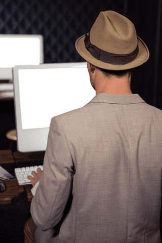 entrepreneur wearing fedora using transparent computer screen - Download Free Stock Videos Pikwizard.com