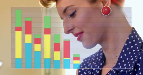 Caucasian businesswoman analyzing colorful graph in office