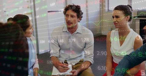 Facilitator guiding team strategy meeting with dynamic stock charts overlay