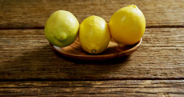Close-up of lemons in a plate on wooden table 4k