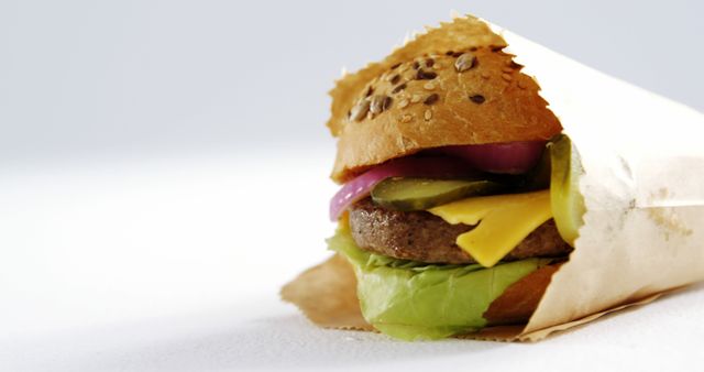 Gourmet Burger with Fresh Toppings Wrapped in Paper - Download Free Stock Images Pikwizard.com