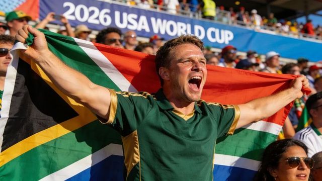 Cheering south african fan waving flag at 2026 usa world cup stadium