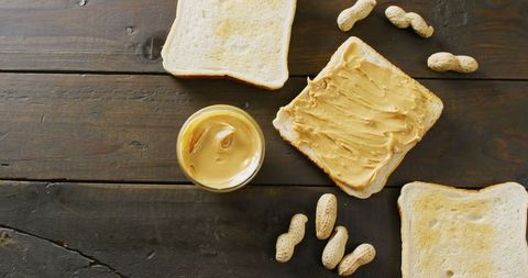 Rustic Peanut Butter Toast with Whole Peanuts on Dark Wooden Table - Download Free Stock Images Pikwizard.com
