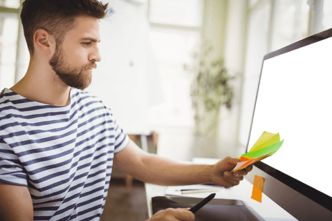 man examining colorful sticky notes in office with transparent monitor - Download Free Stock Videos Pikwizard.com