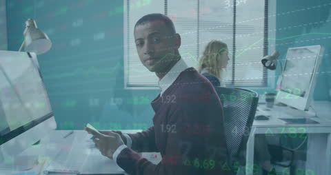 Businessman Analyzing Financial Data and Stock Market Trends in Modern Office