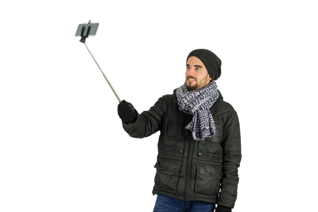 Man in Warm Clothing Taking Transparent Selfie with Selfie Stick - Download Free Stock Videos Pikwizard.com