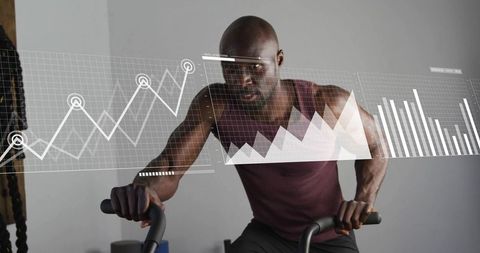 Athlete cycling on stationary bike tracking performance metrics with digital hud overlay