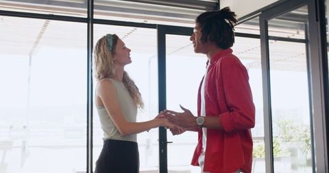 Diverse Colleagues Collaborating on Project Ideas in Office Setting