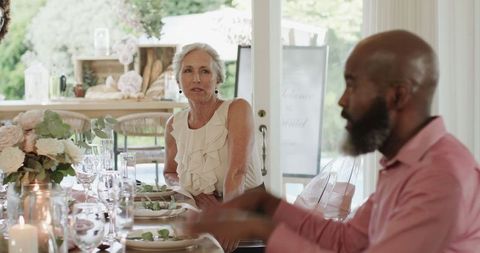 Elegant Wedding Reception with Guests Enjoying Conversation