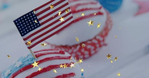 Festive patriotic cupcake with american flag and gold confetti