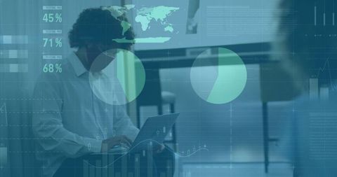 Professional analyzing data with laptop in modern office environment