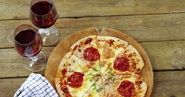Pepperoni Pizza and Red Wine on Rustic Wooden Table - Download Free Stock Images Pikwizard.com