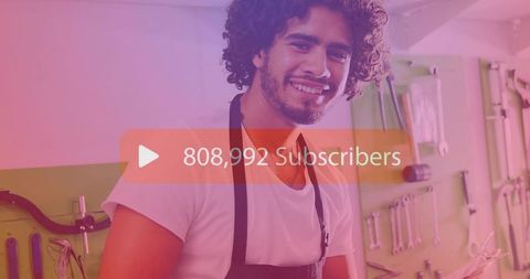 Happy craftsman in workshop reaching new subscriber milestone