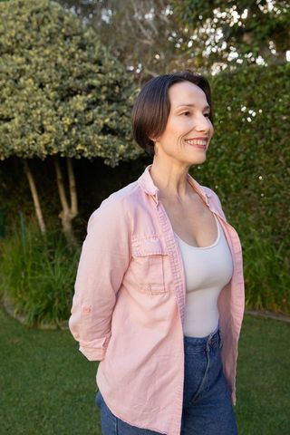 Woman enjoying outdoors in casual pastel clothing