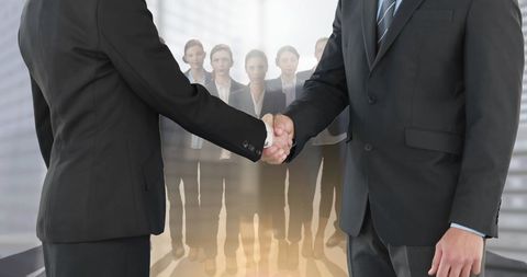 Business Partnership Handshake with Group Hopeful - Download Free Stock Images Pikwizard.com