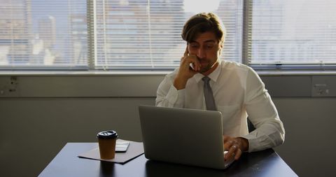 Tired Business Executive Working Late in Modern Office