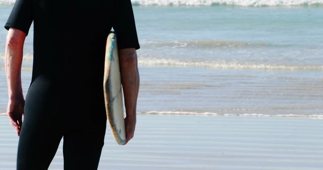 Surfer Standing with Board Looking at Waves at Beach - Download Free Stock Images Pikwizard.com