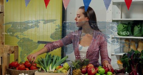 Female Vendor Selecting Fresh Produce at Vibrant Marketplace Stall
